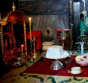 The Liturgy of Preparation or Proskomedia. The Lamb sits on the diskos (paten). The priest takes up the prosphoron for the Living. He then takes out smaller particles in commemoration of others among the living. He must always commemorate the Bishop who ordained him (if he is still among the living), the clergy who are concelebrating with him, and any living Orthodox Christian whom he wishes.