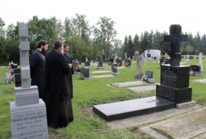 A brief funeral prayer at the burial of Archbishop Panteleimon at the cemetery of the parish at Nisku